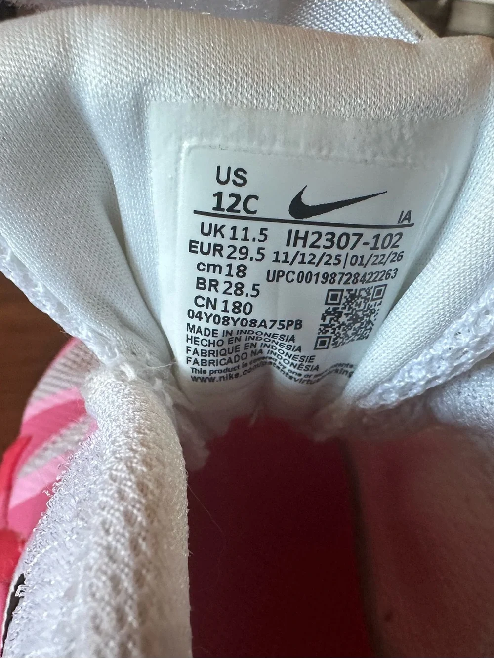 Nike Kids White Sneakers with Pink and Hot Pink Accents and Black Swoosh